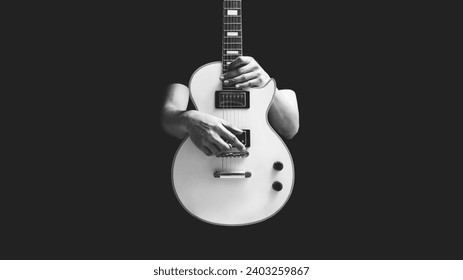 BW male musician posing on white electric guitar, isolated on black. music background - Powered by Shutterstock