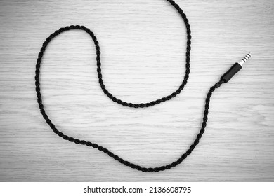 BW pro audio cable on wooden table backdrop