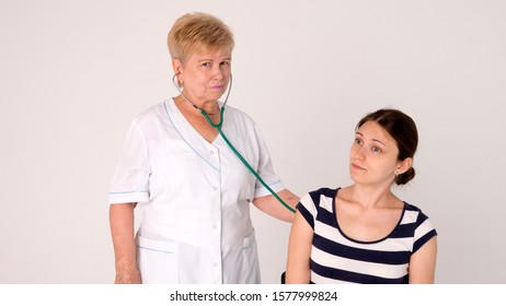 By Medical Prescription. Medical Doctor Examining Patient. Primary Care Doctor Making Diagnosis To Sick Woman. Patient Care And Healthcare. Doctor Visiting Unhealthy Woman At Home