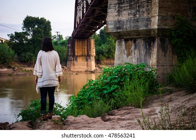 By the river from behind
