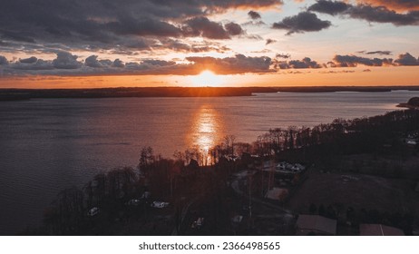 Bydgoszcz, Poland, June 16th 2022 -Beautiful Sunset on Czaplinek Lake with GoldYellow colours in the horizon.