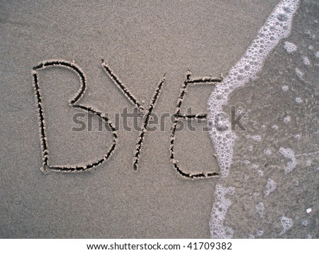 Bye bye written in the sand at the beach