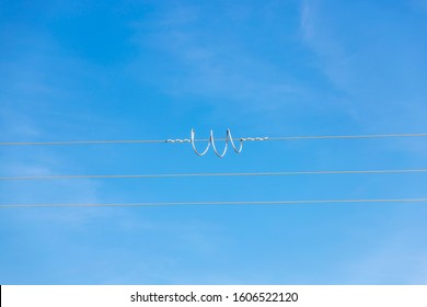 Bypass Over A City's Power Grid Cable With A Beautiful Blue Sky On A Winter Day