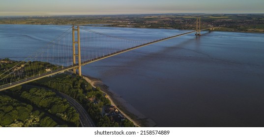 The Bypass Traffic Bridge Over The Sea Water Against A Cloudy Sky At Sunset