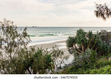 BYRON BAY, AUSTRALIA - SEPTEMBER 20, 2014: Group of surfers waiting to catch a wave at Wategos Beach, Byron Bay, NSW, Australia