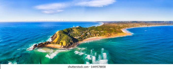 Byron bay and famous lighthouse on the top of headland facing Pacific ocean - the most eastern part of Australian continent.