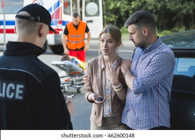 Bystanders describing the scene of an accident to the police officer