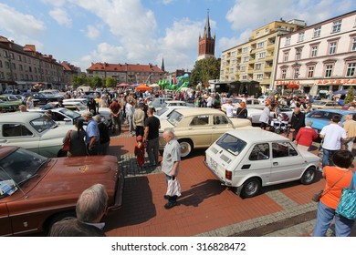 BYTOM, POLAND - SEPTEMBER 12, 2015: People admire classic oldtimer cars during 12th Historic Vehicle Rally in Bytom. The annual vehicle parade is one of main events of this type in Poland.