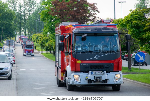 BytomPoland - 06,10,2021. Departure of the fire brigade\
to the rescue operation. Red fire truck. Departure for rescue\
operation. 