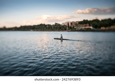 C-1 canoeist on the Guadalquivir river, Seville, Spain. A tilted lens was used for a shallower depth of field.