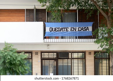 CABA, Buenos Aires / Argentina; June 28, 2020: Argentine Flag With The Message Stay At Home, In The Context Of The Pandemic And The Quarantine To Prevent The Spread Of Coronavirus Disease, Covid-19