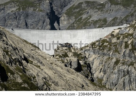 The Cabane de Vieux Emosson alpine refuge mountain station next to the hydroelectric power station dam wall of the Vieux Emosson in Switzerland