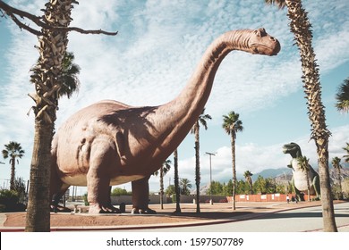 Cabazon, California/United States - 11/22/2019: A View Of The Brontosaurus And Tyrannosaurus Cabazon Dinosaur Roadside Attraction.