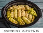 cabbage rolls in the crock pot ready to be cooked