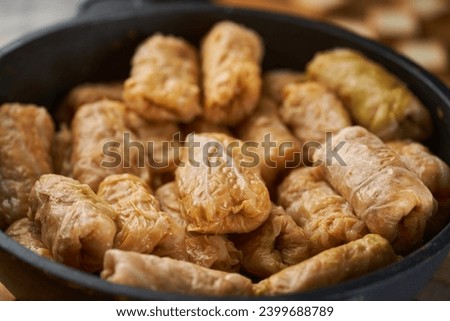 Cabbage rolls with pork meat and rice (sarmale), a traditional Romanian dish, in preparation