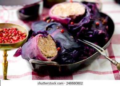 cabbage rolls  from red cabbage with meat and pink pepper sauce
