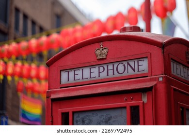 Cabin box in Chinatown (Soho), with LGBT flag in the background