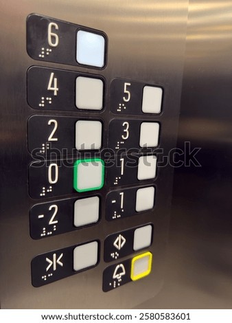 Cabin controls in the elevator with classic buttons in stainless steel design. The buttons indicate individual floors and ground floors.
