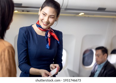 Cabin Crew Or Stewardess Greeting Passengers On Airplane, Air Hostess Or Stewardess Service