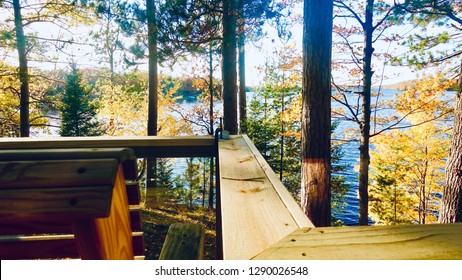 Cabin deck overlooking autumn lakefront - Powered by Shutterstock