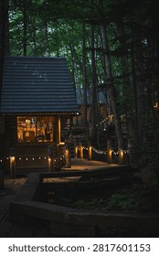 Cabin forest night string light window deck wood tree path warm glow around rustic retreat with illuminated porch quiet woodland setting cozy evening mood