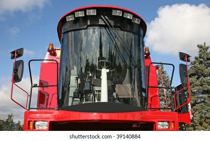 Cabin Modern Combine Harvester Against The Blue Sky