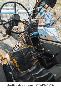 Cabin Of An Old Combine Harvester Abandoned In The Field.