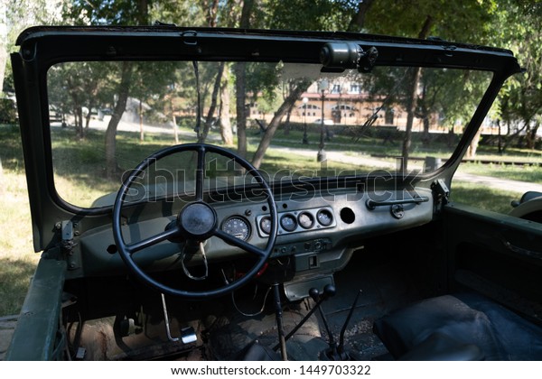 Cabin view of old off-road soviet union military\
light utility car