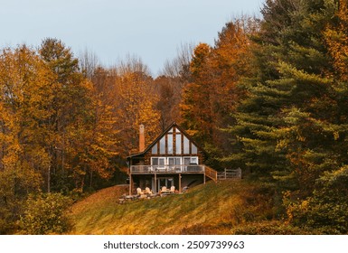 Cabin in the Woods Cloudy Day in Autumn in New England. Fall Foliage Colorful Trees. - Powered by Shutterstock