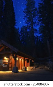 Cabin In The Woods At Night With Redwoods