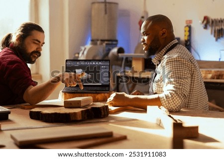 Similar – Image, Stock Photo Master carpenter and apprentice using a clamp for wood gluing in a workshop