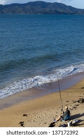 CABLE BAY,NZ-APR 22:Man Fishing From The Beach On April 22 2013.New Zealand Exclusive Economic Zone Covers 4.1 Million Square Kilometers And It's The Sixth Largest Zone In The World.