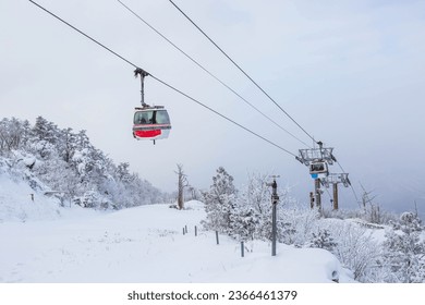 Cable car atop the snow-capped Deogyusan mountains at deogyusan national park near Muju, South Korea.