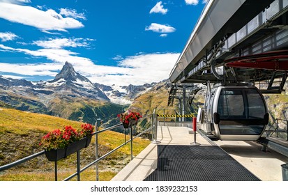 Cable car at Blauherd with the Matterhorn in the background. The Swiss Alps