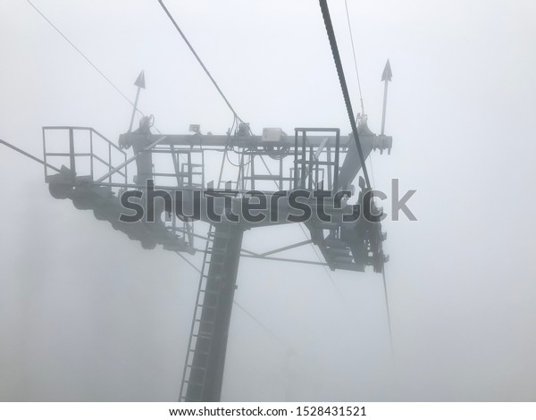 The cable car in fog. Caucasus mountains. Sochi\
area, Russia