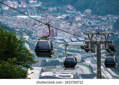 Cable car or gondola to mountain peak. Aerial view of Roza Khutor with traditional cable car above the city, in Sochi, Russia. Rosa Khutor. Krasnaya Polyana