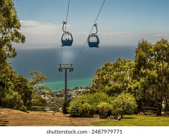 Cable Car Gondolas Going Down To The Sea