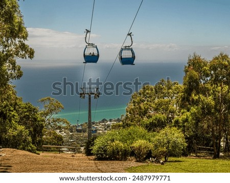 Cable Car Gondolas Going Down To The Sea