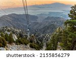 Cable car leading up to Mount San Jacinto in Palm Springs during sunset with pastel background. 