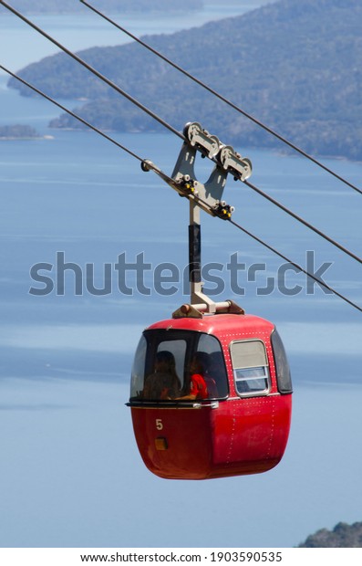 cable car line in bariloche,\
red cabins. Tourist attraction in Cerro Otto, Rio Negro\
Argentina