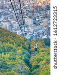 Cable car over mountain and city central of Sapparo Japan during Autumn season