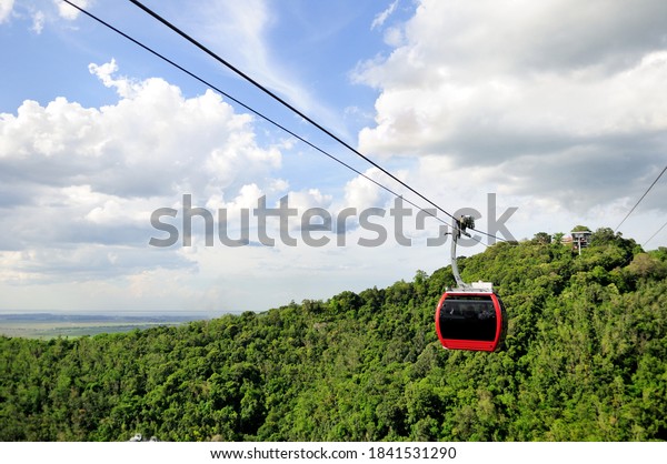 Cable car\
overlooking beautiful green hills at Hat Yai Municipal Park in Hat\
Yai, Songkhla Province,\
Thailand.