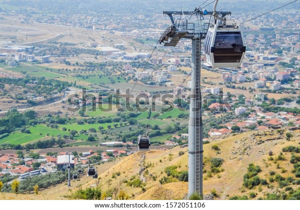 Cable car overlooking a\
village
