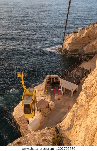 Cable car to Rosh Hanikra in\
Israel. Rosh Hanikra is a geologic formation of a white chalk cliff\
with spectacular grottos located on the north coast of\
Israel