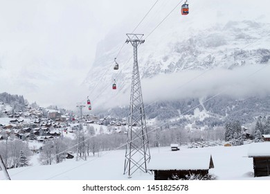 Cable Car In Snow In Winter With Trees Above The City Of Interlaken, Switzerland