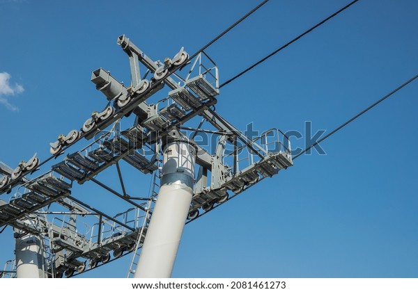 Cable car\
support wire rope on clear sky\
background.