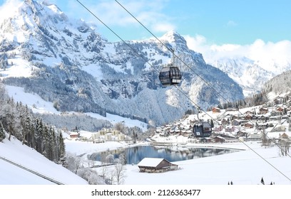 Cable car Titlis, view of Engelberg in Switzerland. Village in winter. Mountains covered with white snow. Swiss Alps. Ski resort in Switzerland Engelberg February 11, 2022