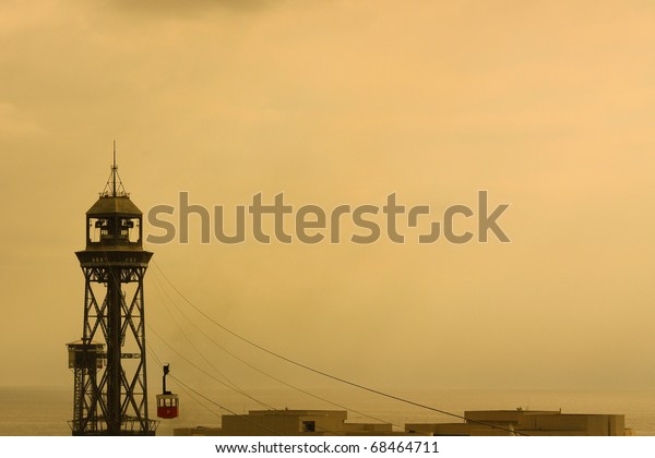 Cable car tower. In the\
image, leaving the Tower funicular San Sebastian in the port of\
Barcelona. Spain.