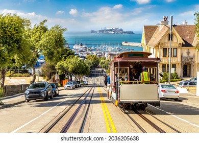 The Cable car tram and Alcatraz prison island on a background in San Francisco, California, USA