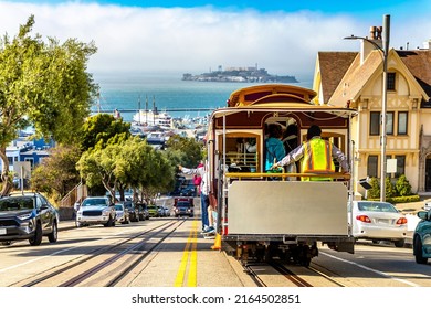The Cable car tram and Alcatraz prison island on a background in San Francisco, California, USA